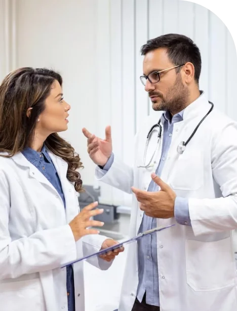 cardiologists discussing diagnosis and treatment options